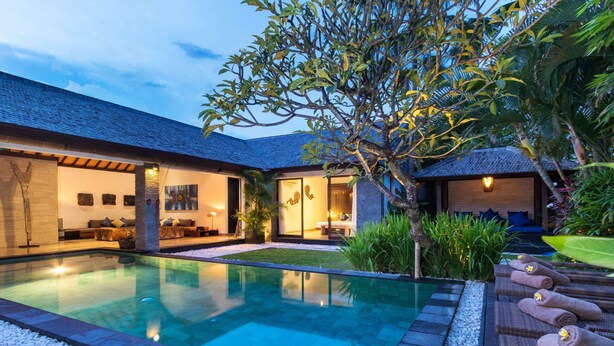A modern house with a swimming pool, outdoor seating, and a well-maintained garden. - Bali Villa Near the Beach, 2080 (Seminyak)
