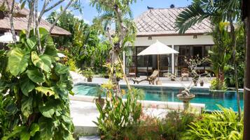 An infinity pool, pool loungers