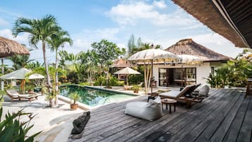 An infinity pool, pool loungers