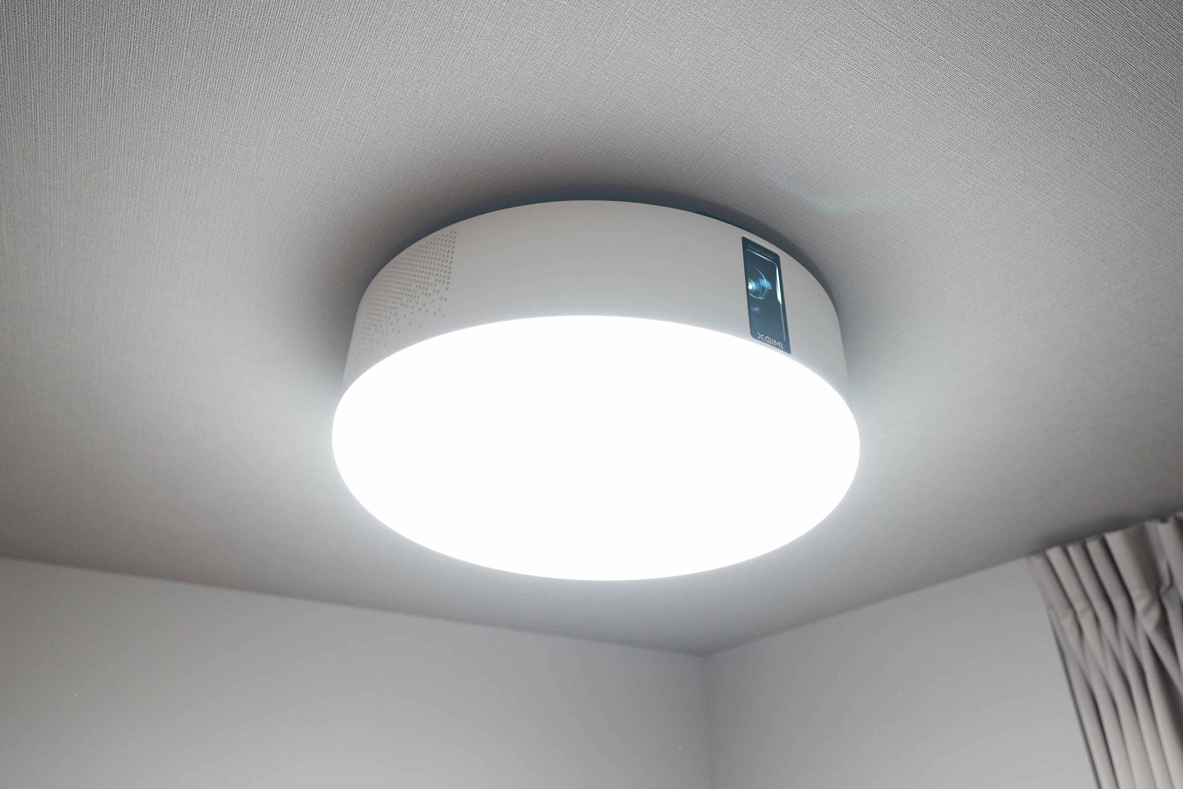 A ceiling with a circular light fixture.