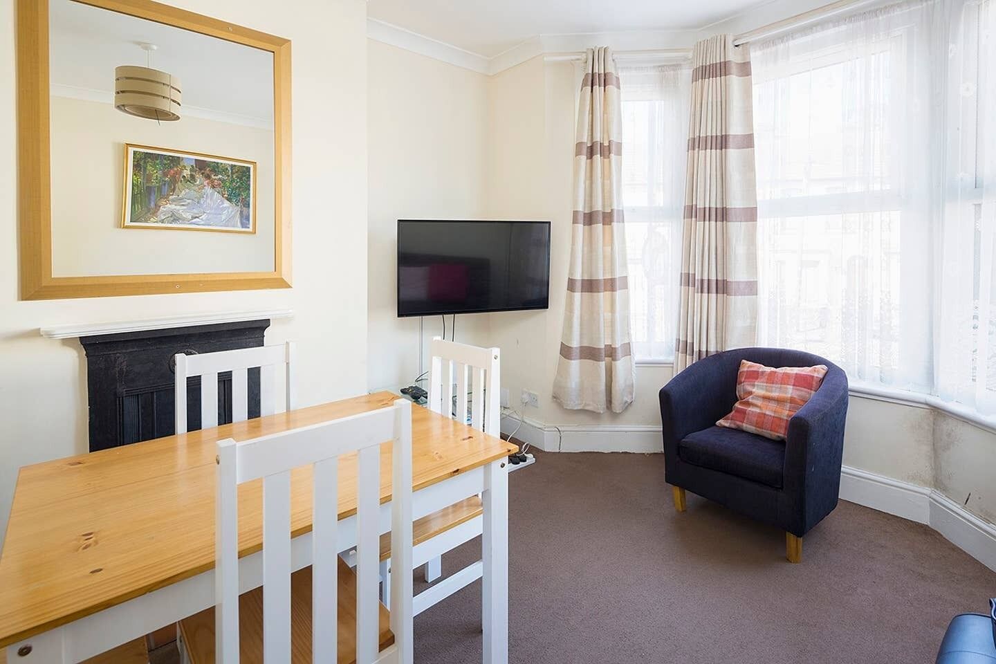 Three-Bedroom Apartment | Living room | Flat-screen TV