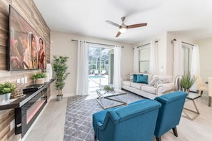 Family Townhome, Garden Area | Living room | Flat-screen TV, video-game console
