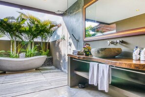 A modern bathroom with a large freestanding bathtub, a wooden vanity, and a large mirror. - Luxury Villa in Bali near Beach, Bali Villa 2086 (Seminyak)