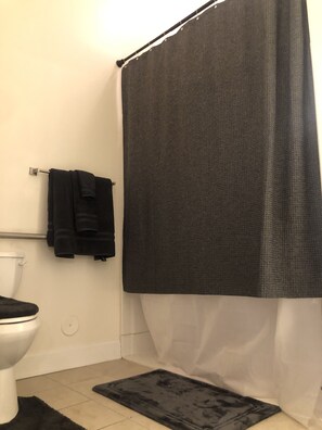 Shower, towels, soap, toilet paper - Vibrant Contemporary Luxury (Charlotte)