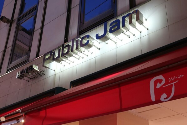 A building with a sign that reads "Public Jam."