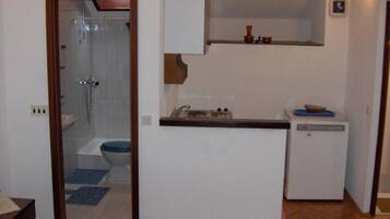 Studio Apartment with Balcony (A3) | Private kitchenette | Fridge, stovetop, cookware/dishes/utensils