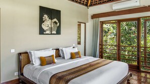 A bedroom with a large bed, a wooden ceiling, and a view of greenery through a window. - Beautiful Villa With Private Pool, Bali Villa 2017 (Seminyak)