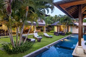 A poolside area with lounge chairs, a small pool, and tropical plants. - Beautiful Villa With Private Pool, Bali Villa 2017 (Seminyak)