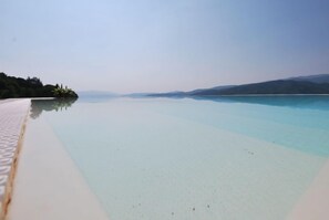 Seasonal outdoor pool, pool umbrellas, pool loungers