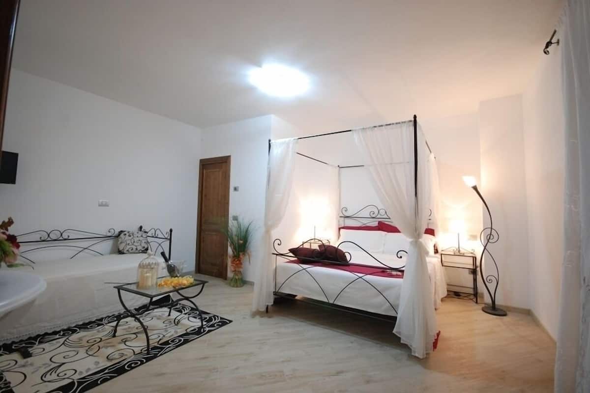 Superior Quadruple Room (Falterona) | In-room safe, iron/ironing board (on request), free WiFi, bed sheets