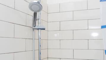 Bathtub, towels, soap, toilet paper