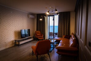 Appartement Exclusif, 3 chambres, cuisine, vue plage | Coin séjour