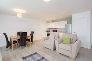 Apartment, 2 Bedrooms | Living area | 26-inch flat-screen TV with digital channels, TV