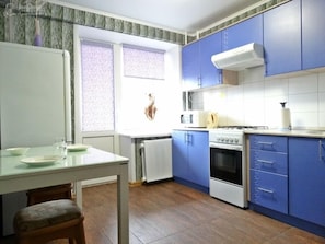 Apartment | Private kitchen | Full-size fridge, microwave, stovetop, electric kettle
