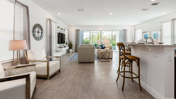 A modern living room with a sofa, chairs, a coffee table, and a TV. - ⛱ Reunion-Golf Course Home- 5 Star Resort ☀ (Kissimmee)