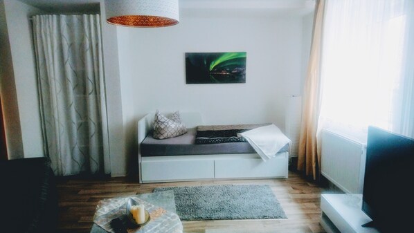 Appartement, rez-de-chaussée | Coin séjour