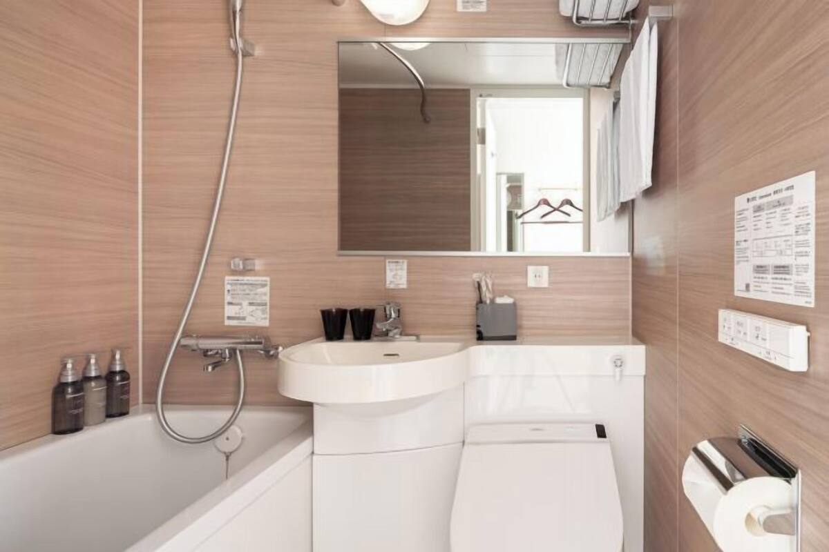Bathroom | Free toiletries, hair dryer, slippers, electronic bidet