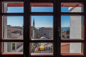 Deluxe Double Room, Partial Sea View | Egyptian cotton sheets, premium bedding, down comforters, minibar