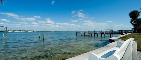 Enjoy serene waterfront views from the dock, surrounded by calm waters.