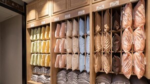 A store with shelves of pillows and folded blankets in various colors. - Super Hotel Premier Saitama Omiyaeki Higashiguchi (Saitama)