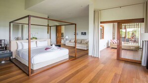 A modern bedroom with a four-poster bed, a sofa, and a view of the outdoors. - Beautiful Villa with Private Pool, Bali Villa 2059 (Bali)