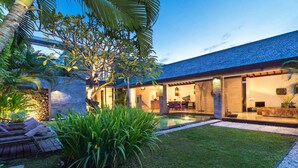 A modern house with a swimming pool, a well-maintained lawn, and a patio area. - 5 Star Villa in Bali, Minutes from the Beach, Bali Villa 2080 (Bali)