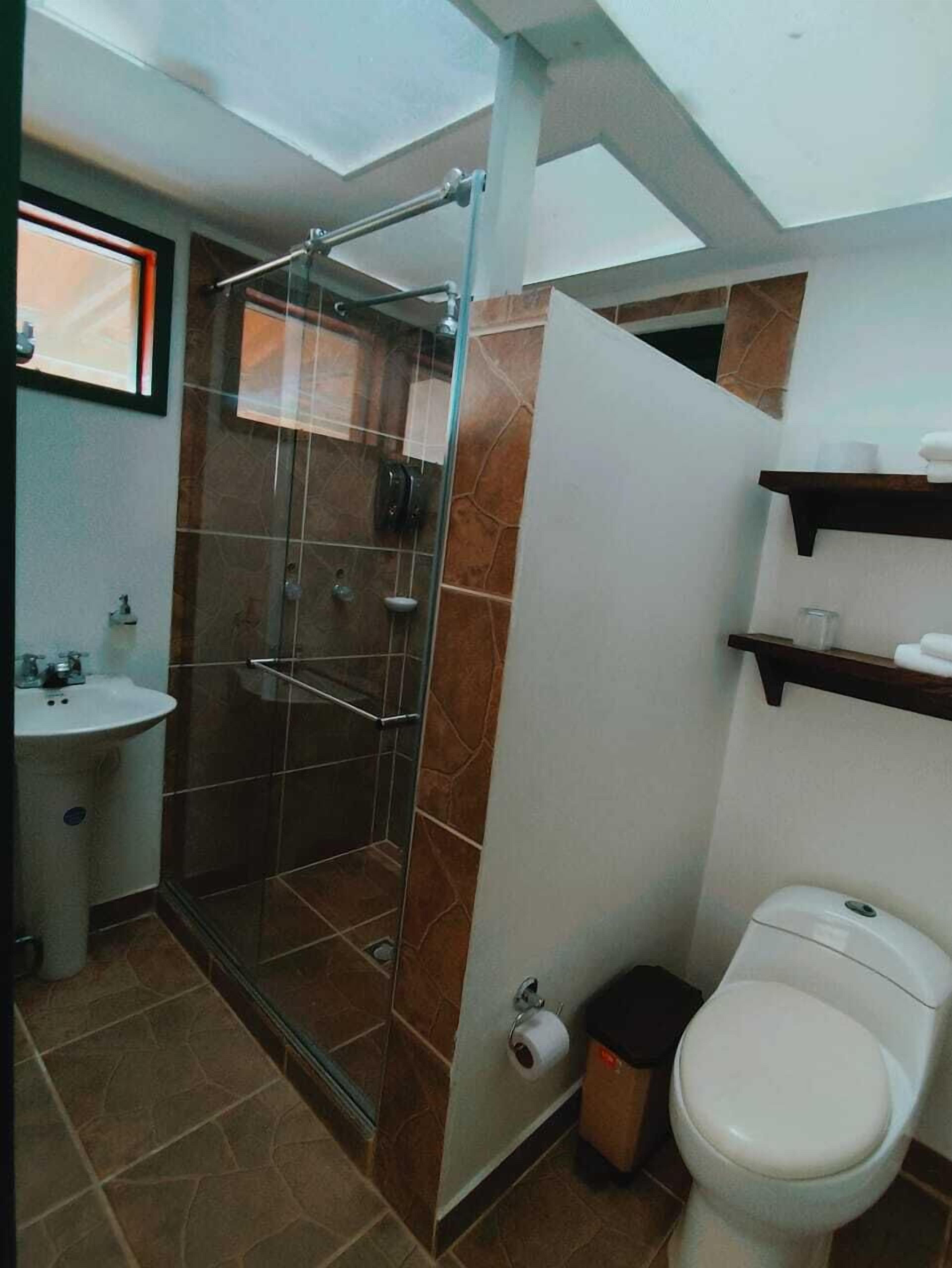 shower, rainfall showerhead, hair dryer, towels