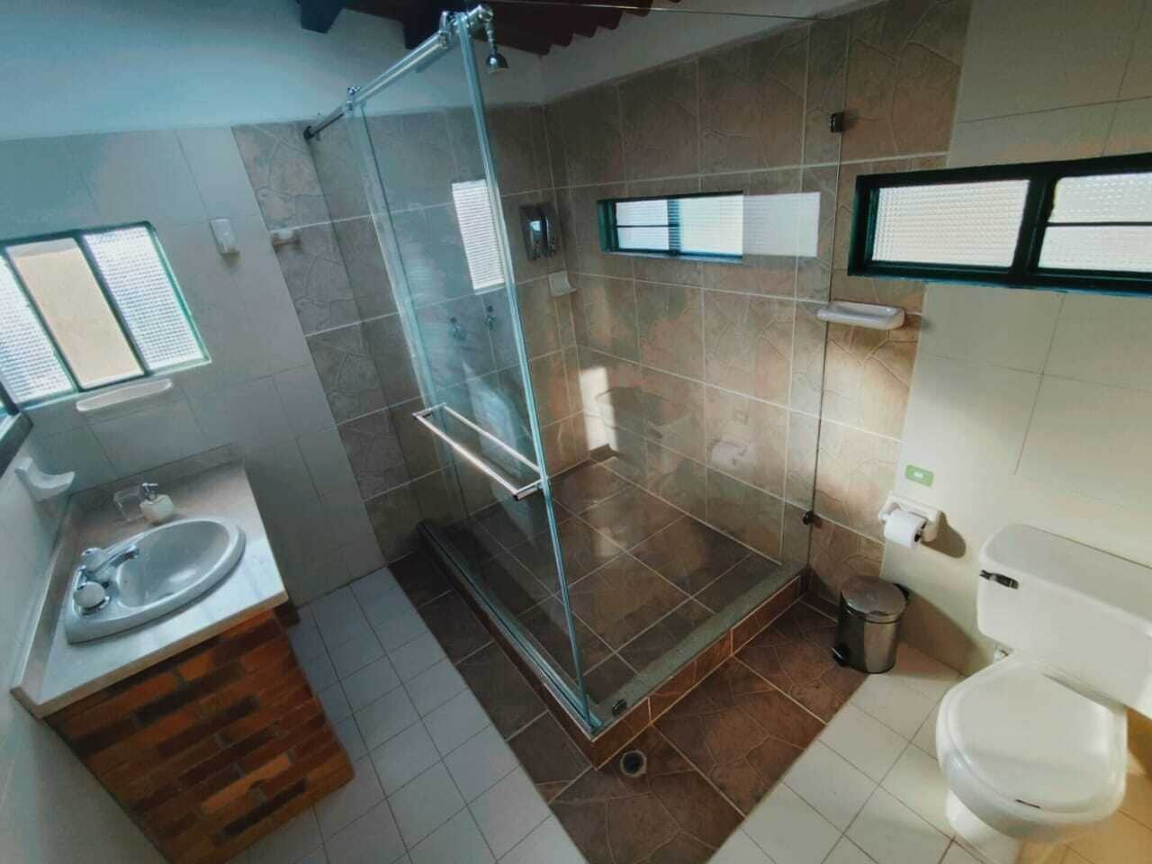 comfort quadruple room | bathroom | shower, rainfall showerhead, hair dryer, towels