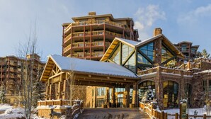 A multi-story lodge with a prominent entrance, stone facade, and a snow-covered landscape. - Two Bedroom Luxury Villa, Park City, Utah (1920607) (Park City)