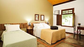 Triple Room | Minibar, blackout curtains, free WiFi, bed sheets
