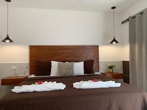 Comfort Double Room | Down comforters, minibar, in-room safe, individually decorated - Hotel La Casa del Capi (Isla Holbox)