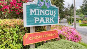 A sign for Mingu Park with a smaller sign for Choshi Gardens. - Very clean house with amazing park across the street and Japanese garden. (Coos Bay)