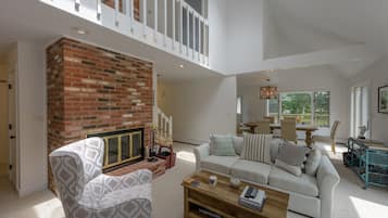 TV, fireplace, books