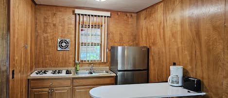 Full-size fridge, stovetop, coffee/tea maker, toaster