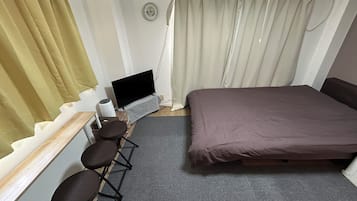 Standard Room (203) | Desk, laptop workspace, blackout drapes, iron/ironing board