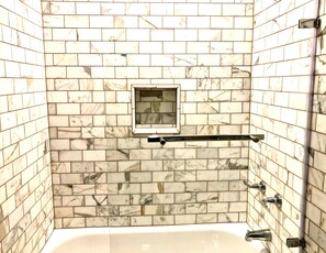 Combined shower/tub, hair dryer, towels, soap
