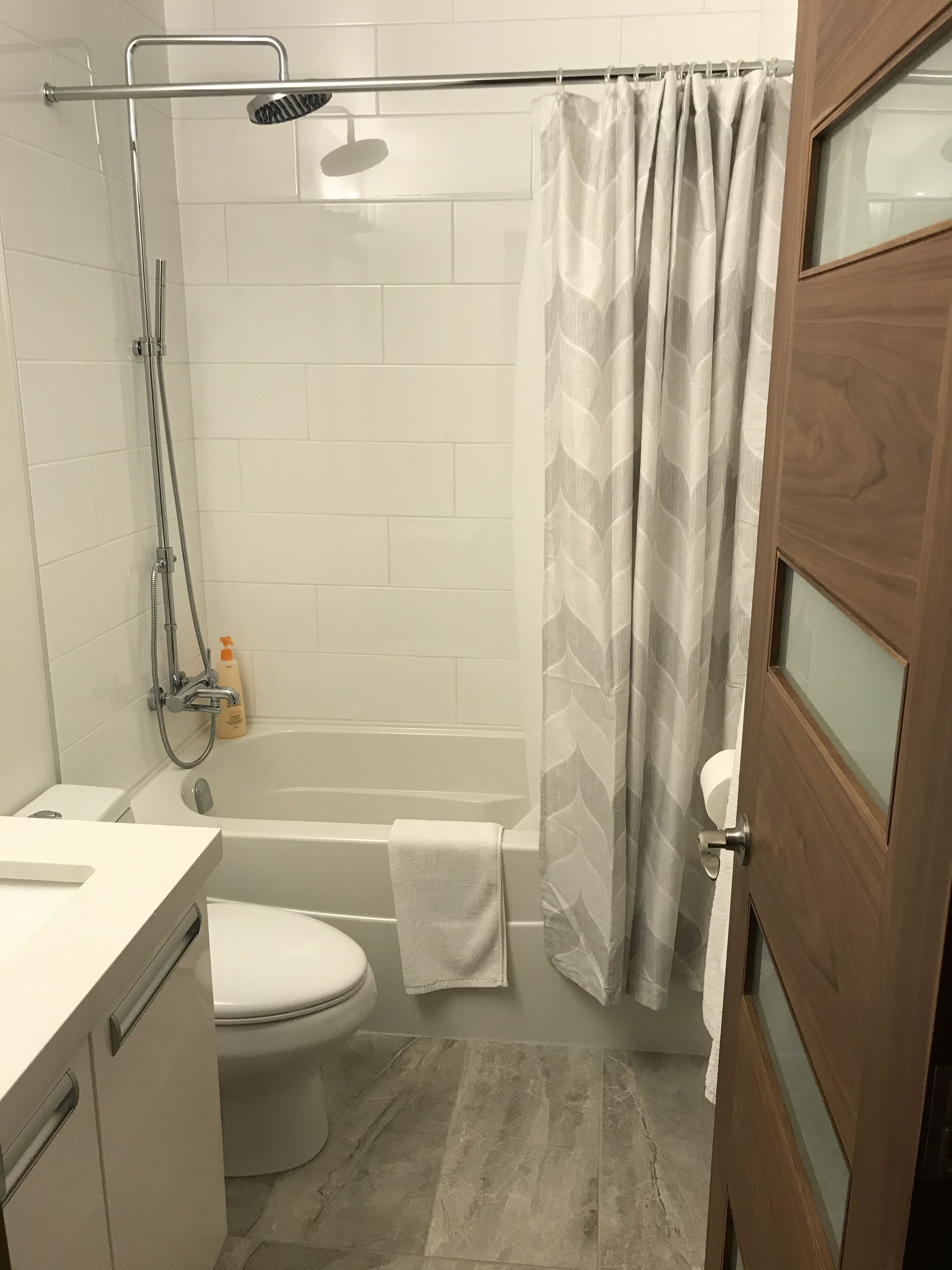 Combined shower/tub, hair dryer, towels, toilet paper