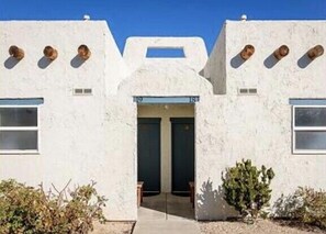 A building with a symmetrical facade, large windows, and a central entrance. - 19 Resort- Double King, Pool, Hot Tub, Kitchen, Grill (St. George)