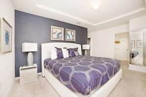A bedroom with a large bed, two bedside tables, a nightstand, and a wardrobe. - Ev7827ha - Solterra Resort - 5 Bed 4.5 Baths Townhouse (Davenport)