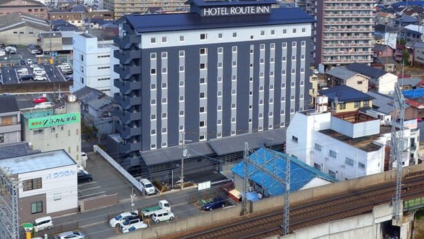 A multi-story building with a sign reading "HOTEL ROUTE INN". - Hotel Route Inn Sakurai Ekimae (Sakurai)