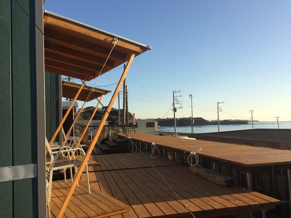Relax and socialize in this tranquil outdoor space with scenic views of a body of water.