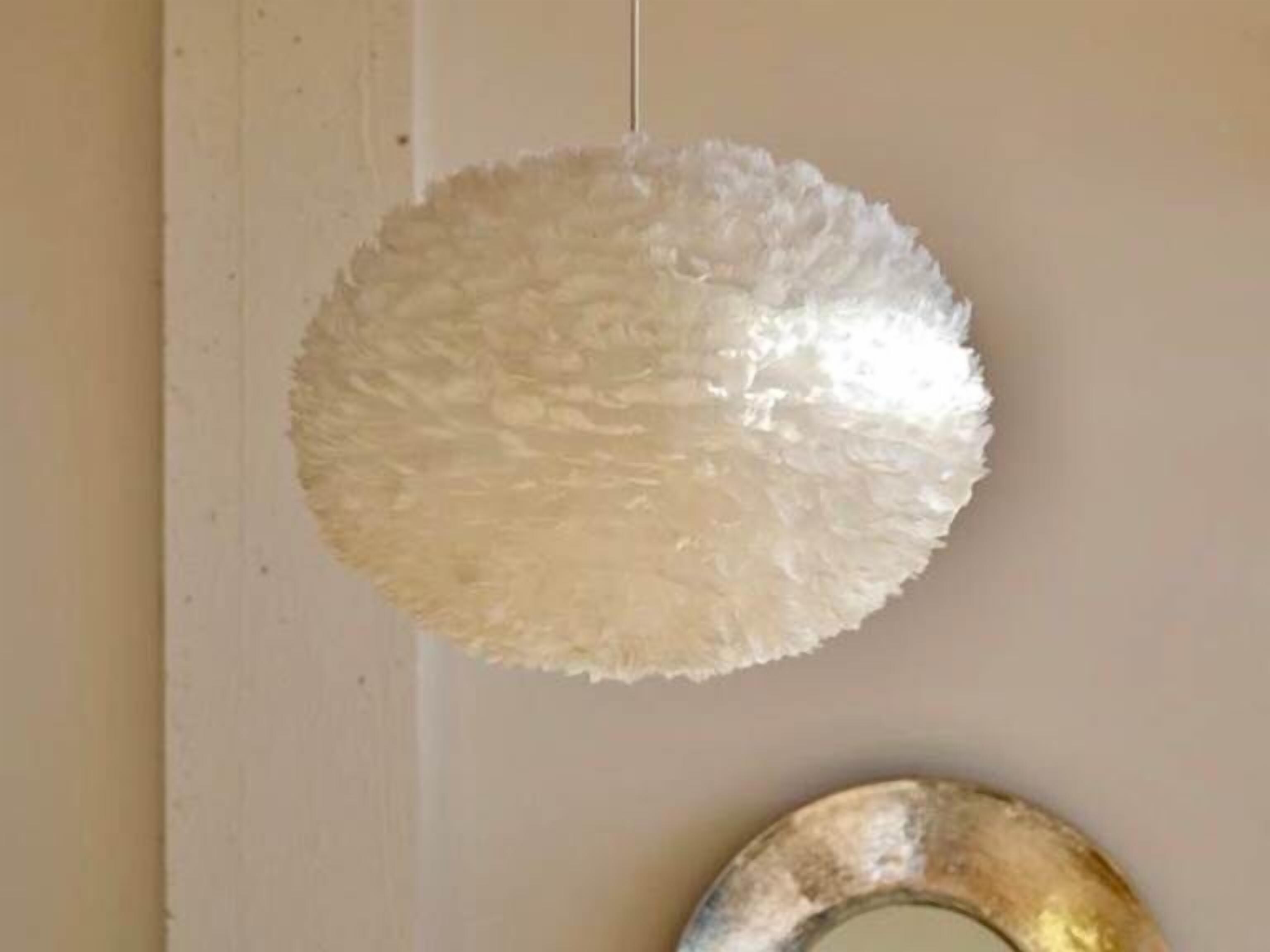 A round, textured wall decoration.