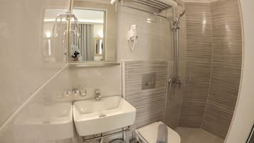 Shower, rainfall showerhead, designer toiletries, hair dryer