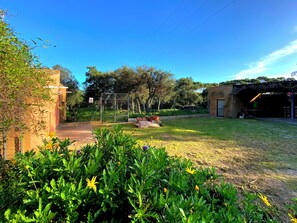Escape to a serene oasis surrounded by lush greenery and vibrant flowers.