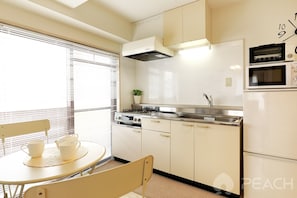 2 Bedroom Apartment | Private kitchenette | Fridge, microwave, rice cooker, cookware/dishes/utensils