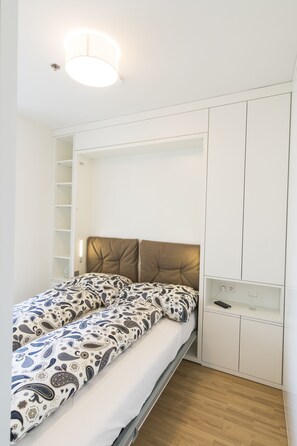 Desk, blackout drapes, soundproofing, iron/ironing board