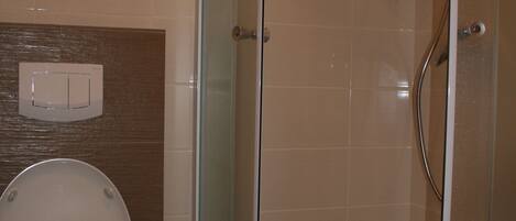 Apartment, 1 Bedroom | Bathroom | Shower, free toiletries, hair dryer, towels