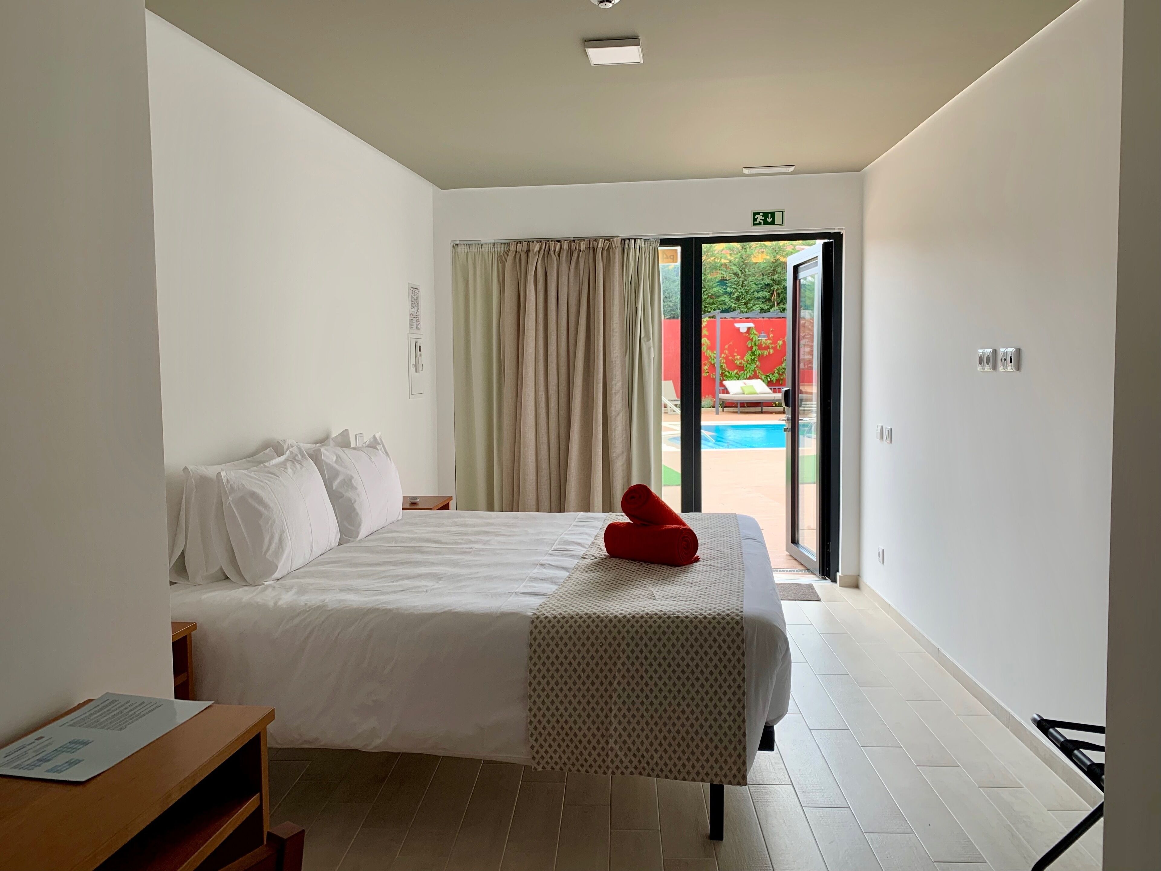 double room, pool view | in-room safe, blackout curtains, soundproofing, free wifi