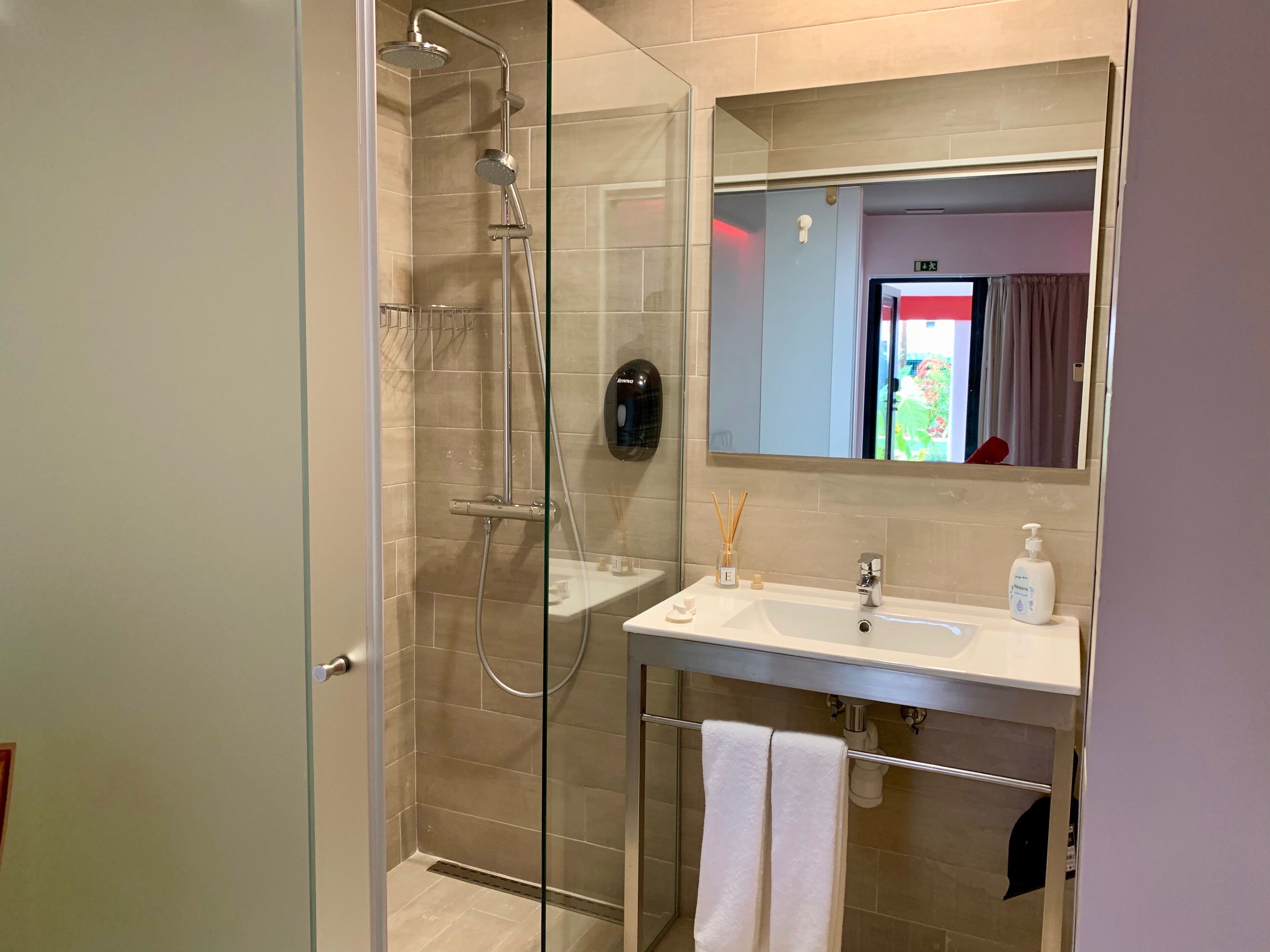 double room, pool view | bathroom | shower, rainfall showerhead, towels