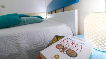 Apartamento, 1 quarto, sacada, vista para a cidade | 2 quartos, ferros/tábuas de passar roupa